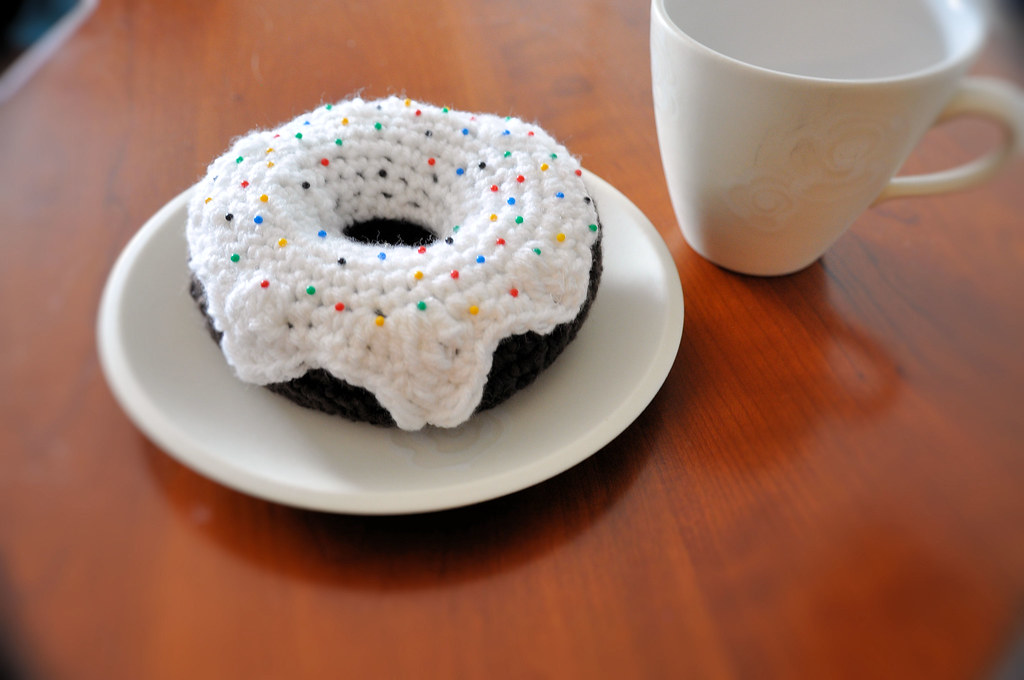 crochet black and white donut with sprinkles